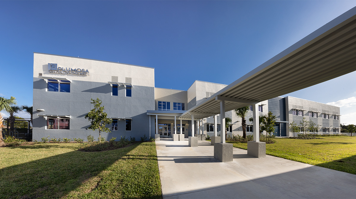 Architectural dusk view of the Plumosa School of the Arts in Delray Beach. FL.